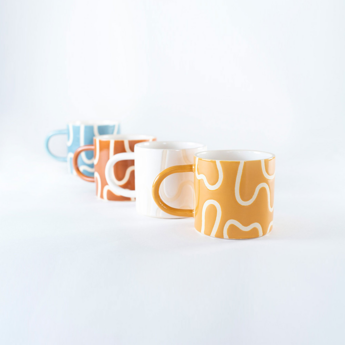 http://www.abroadmodern.com/cdn/shop/products/WiggleCeramicCoffeeMugs_Group_1200x1200.png?v=1670476787